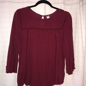 Maroon blouse with detailing in the front
